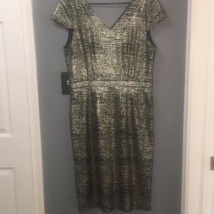 Fun and flirty, gold tweed cap-sleeve dress.